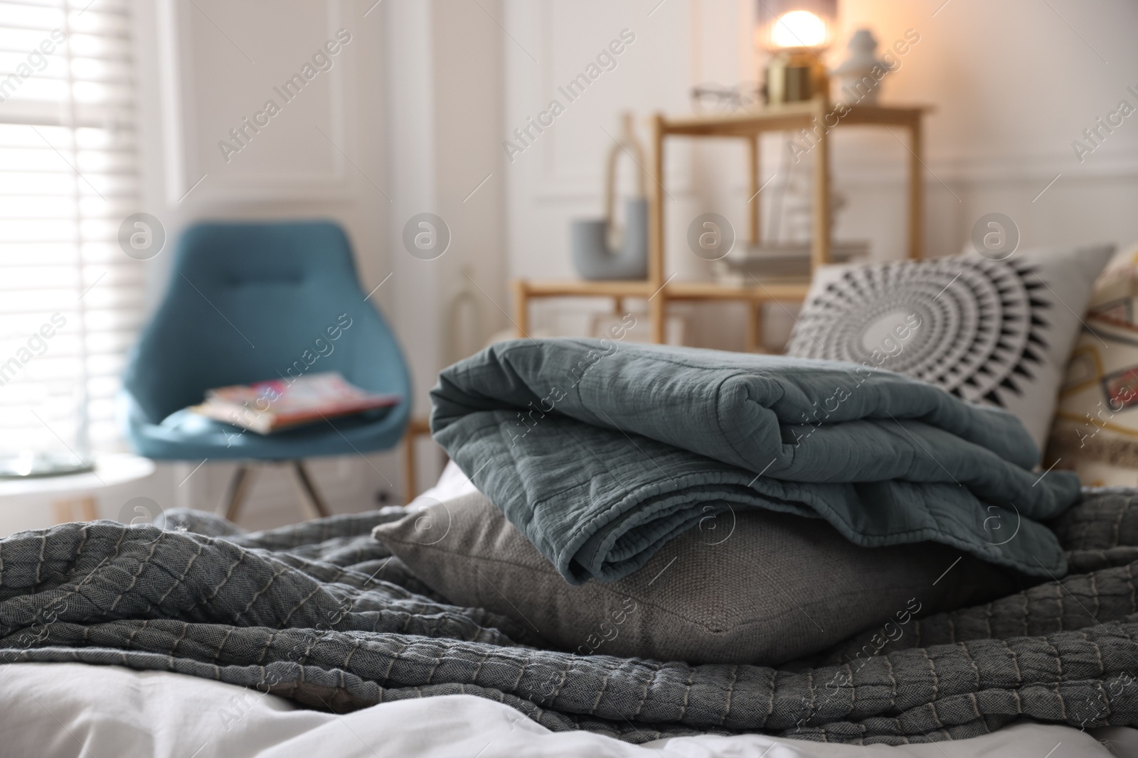 Fresh linens on bed indoors. Home textile Photo of Fresh linens on bed indoors. Home textile