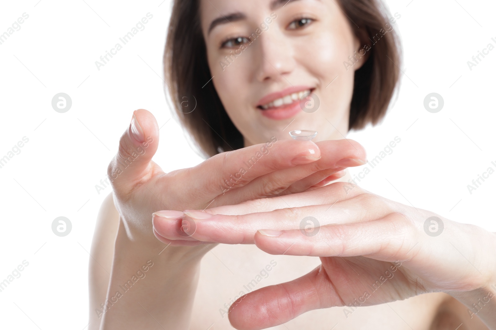 Woman with contact lens on white background, selective focus Photo of Woman with contact lens on white background, selective focus