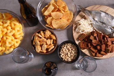Photo of Beer and snacks on grey table, flat lay