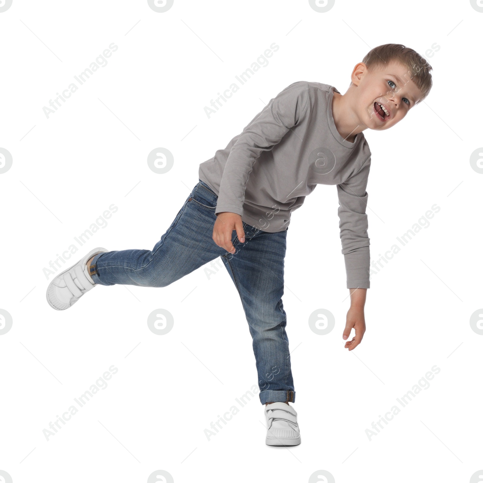 Happy little boy dancing on white background Photo of Happy little boy dancing on white background