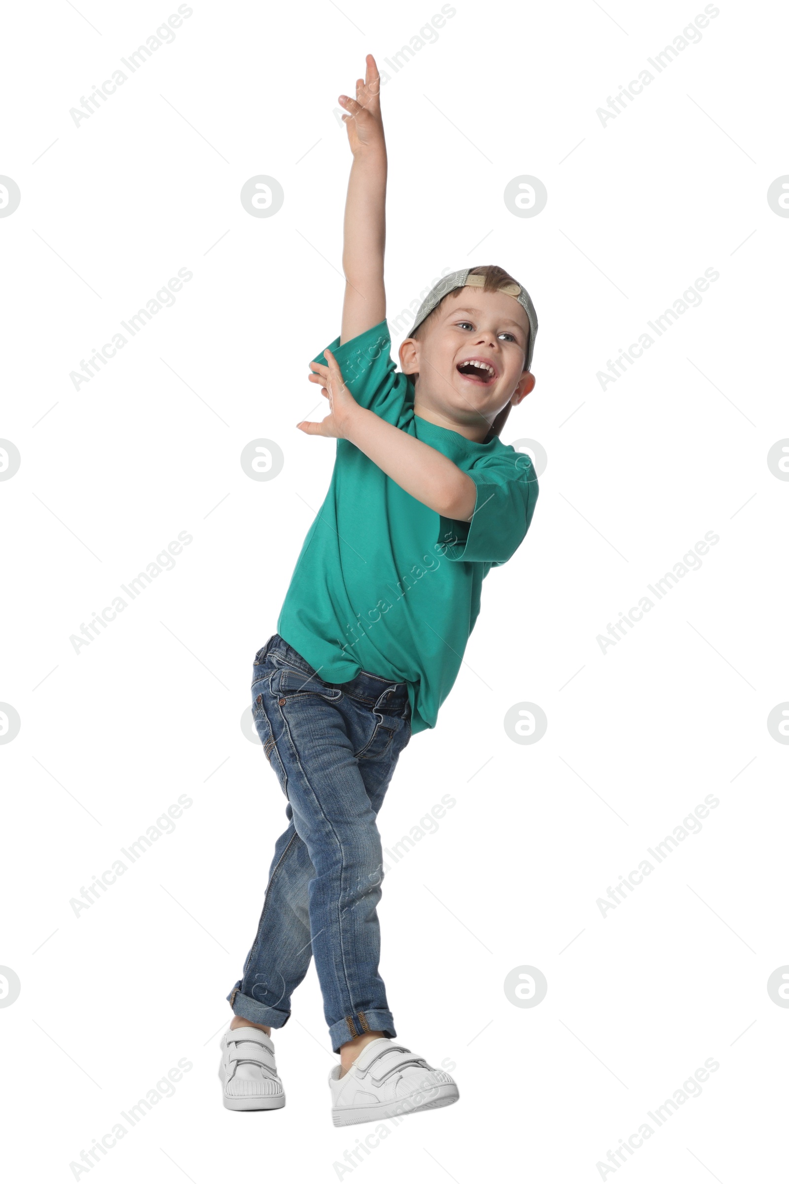 Happy little boy dancing on white background Photo of Happy little boy dancing on white background
