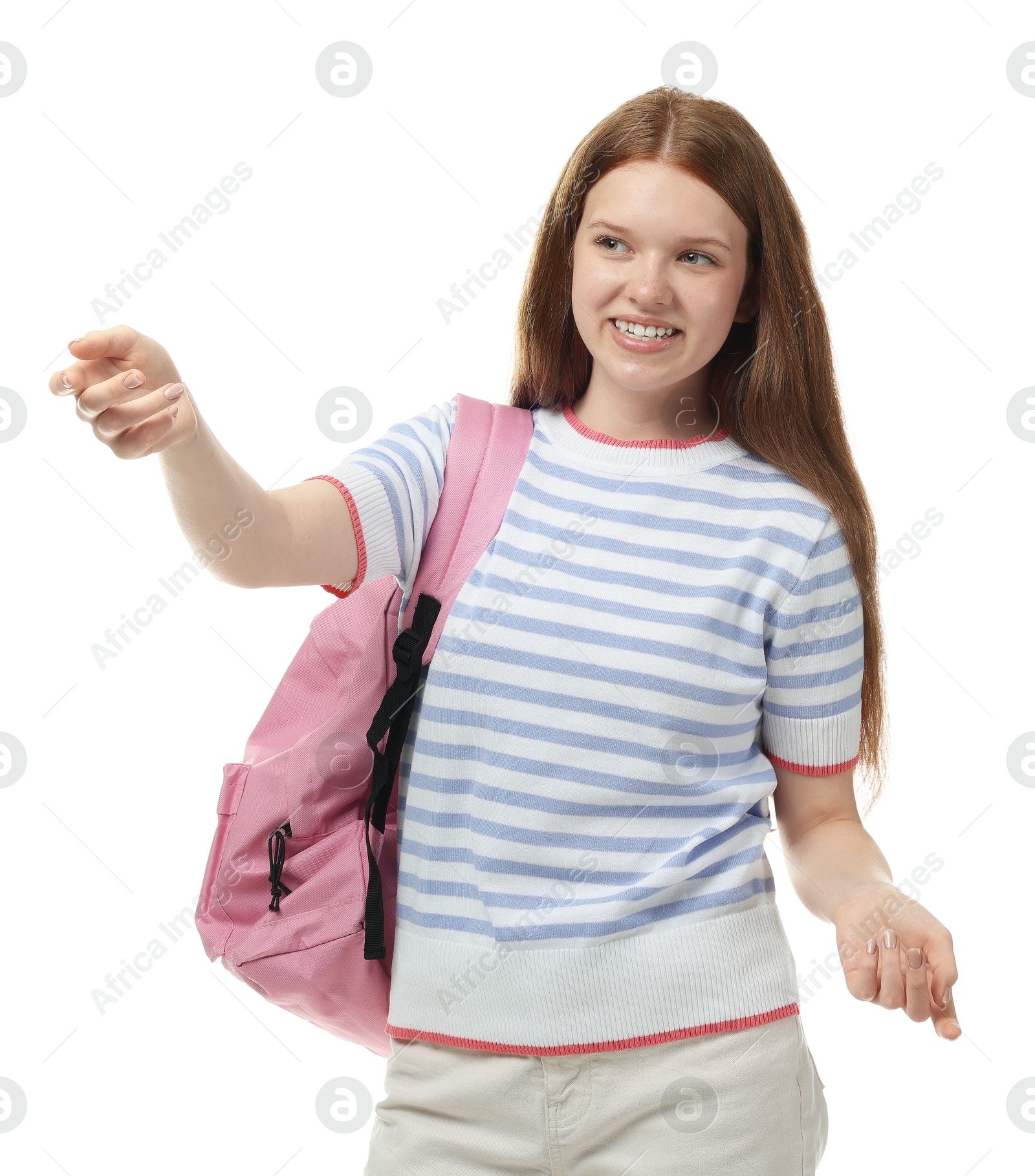 Teenage girl pointing at something on white background Photo of Teenage girl pointing at something on white background
