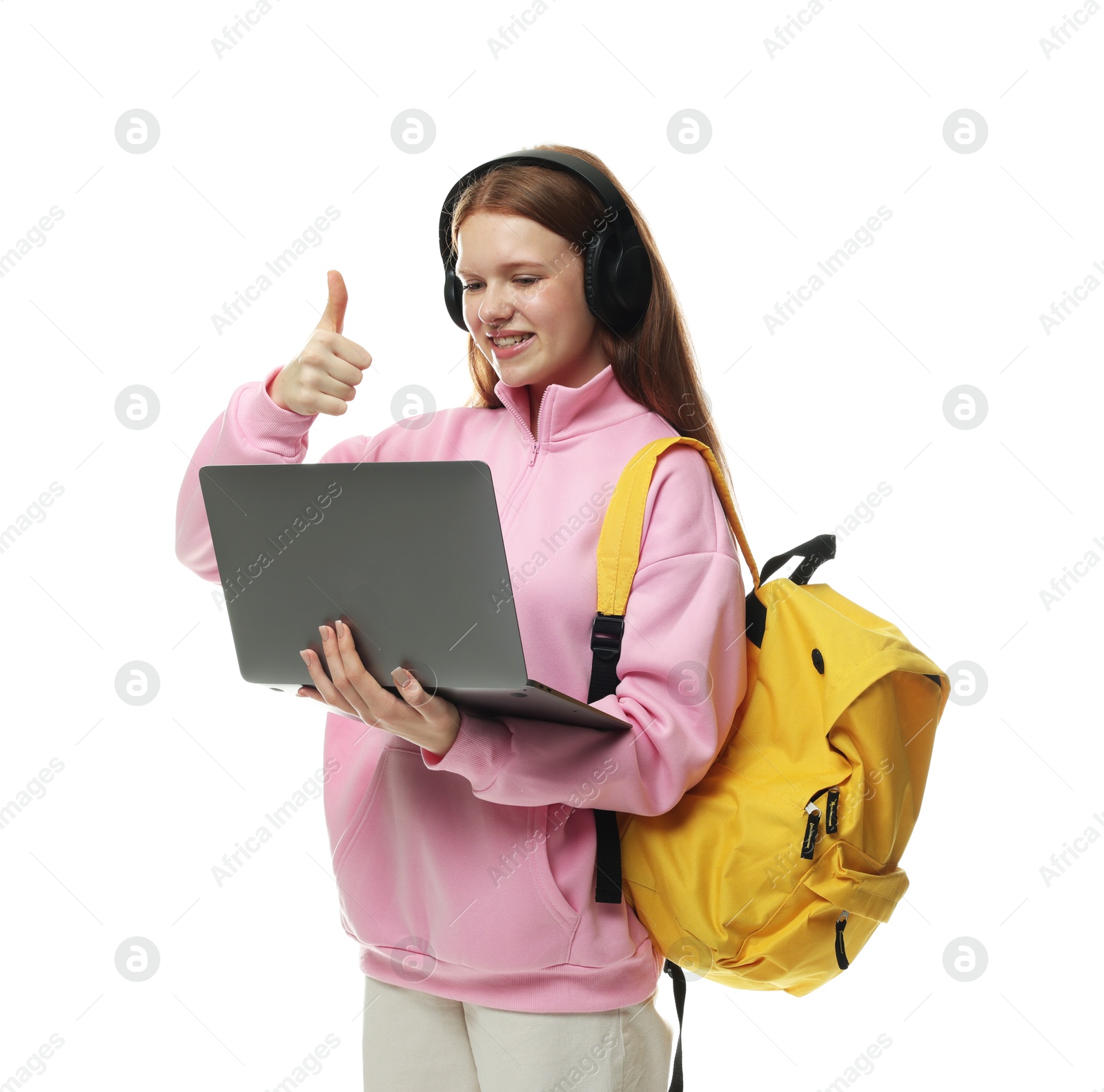 Photo of Teenage girl showing thumbs up during video call on white background