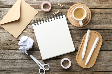 Photo of Flat lay composition with open blank notebook on wooden table