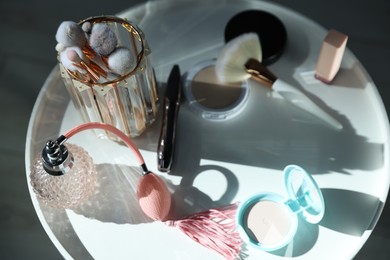 Photo of Different makeup products on white table indoors, above view