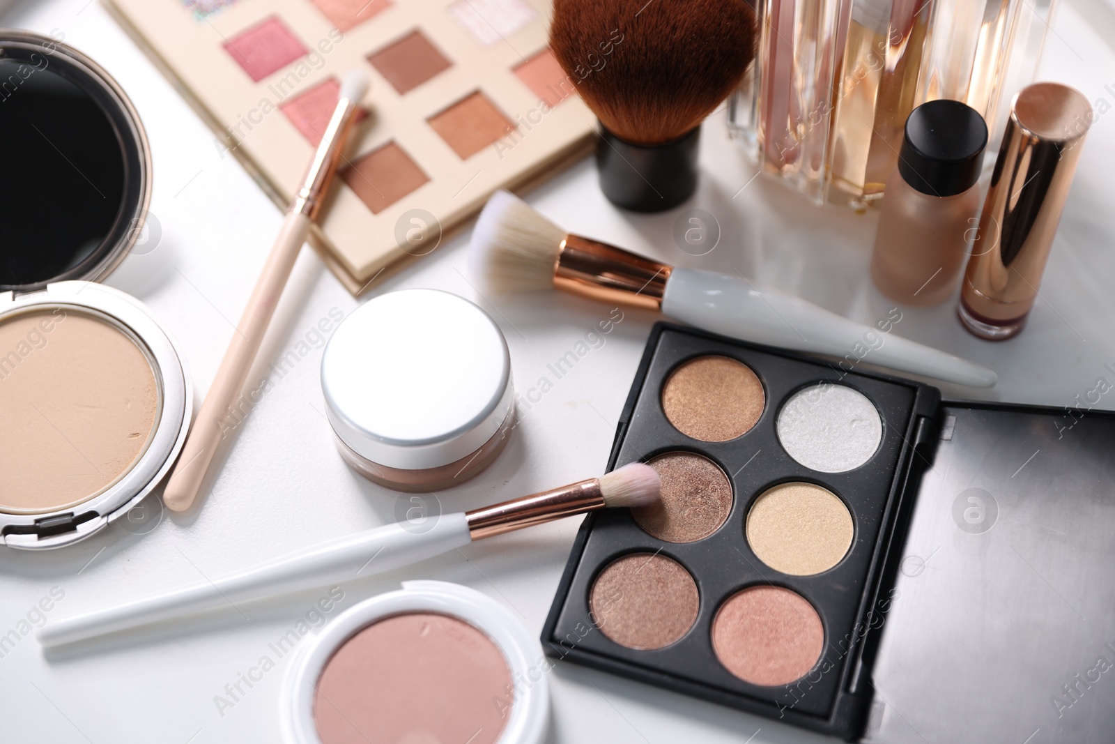 Photo of Different makeup products on white table, above view