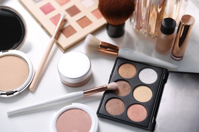 Photo of Different makeup products on white table, above view