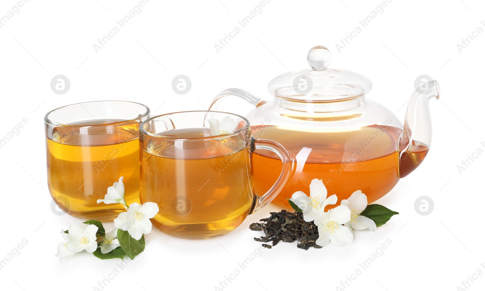 Aromatic jasmine tea in glass cups, teapot, flowers and leaves isolated on white Photo of Aromatic jasmine tea in glass cups, teapot, flowers and leaves isolated on white