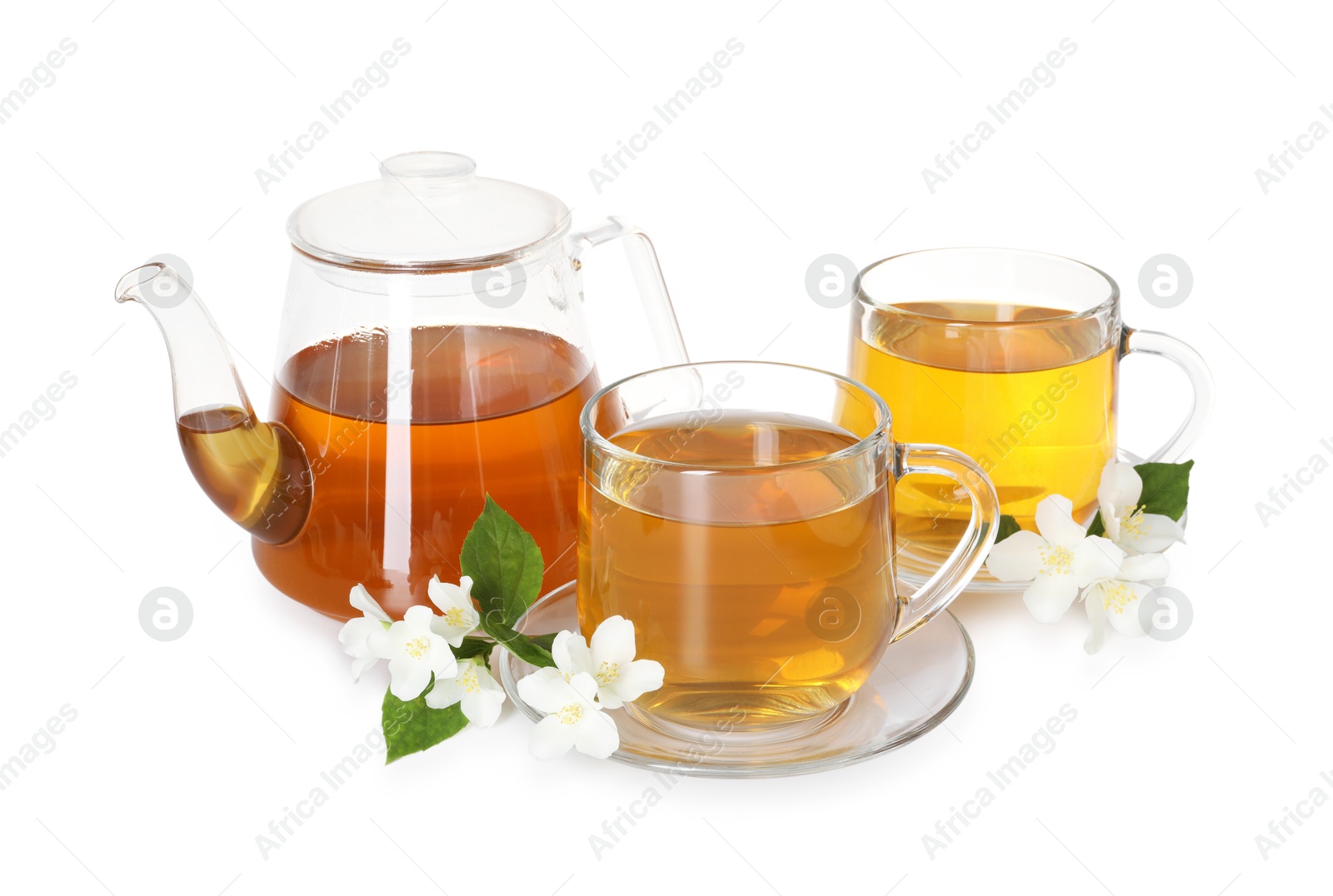 Aromatic jasmine tea in glass cups, teapot, flowers and green leaves isolated on white Photo of Aromatic jasmine tea in glass cups, teapot, flowers and green leaves isolated on white