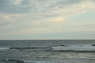 Photo of View of beautiful wavy sea under blue sky