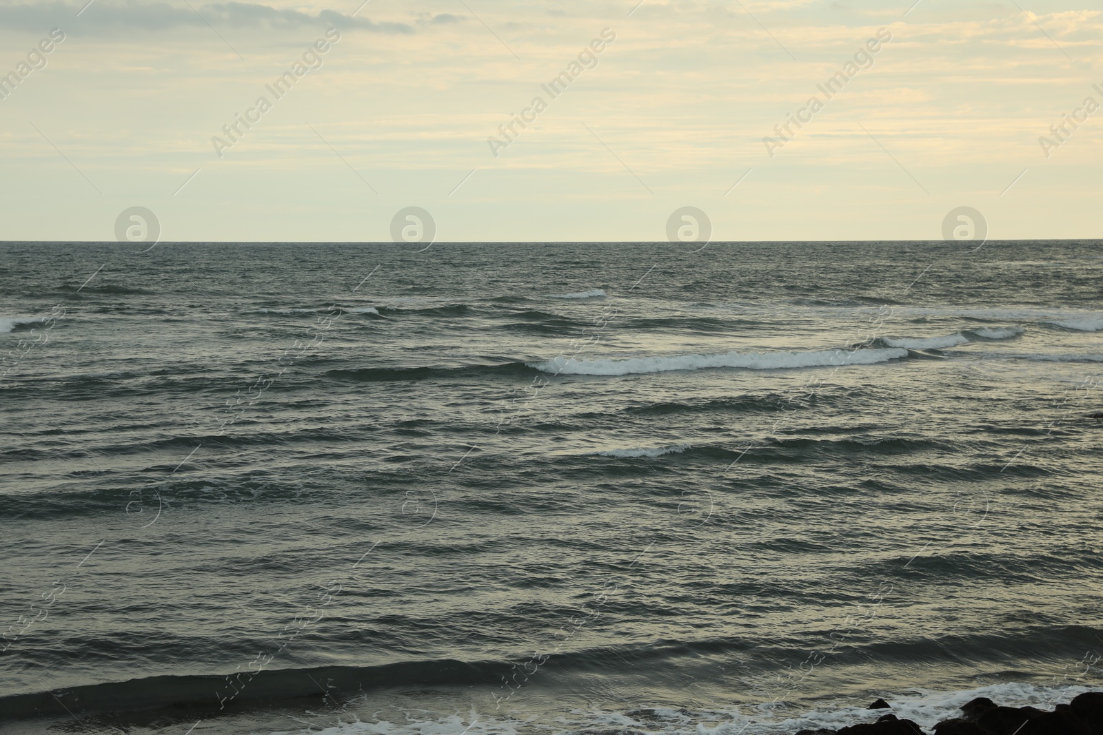 View of wavy sea under beautiful sky Photo of View of wavy sea under beautiful sky
