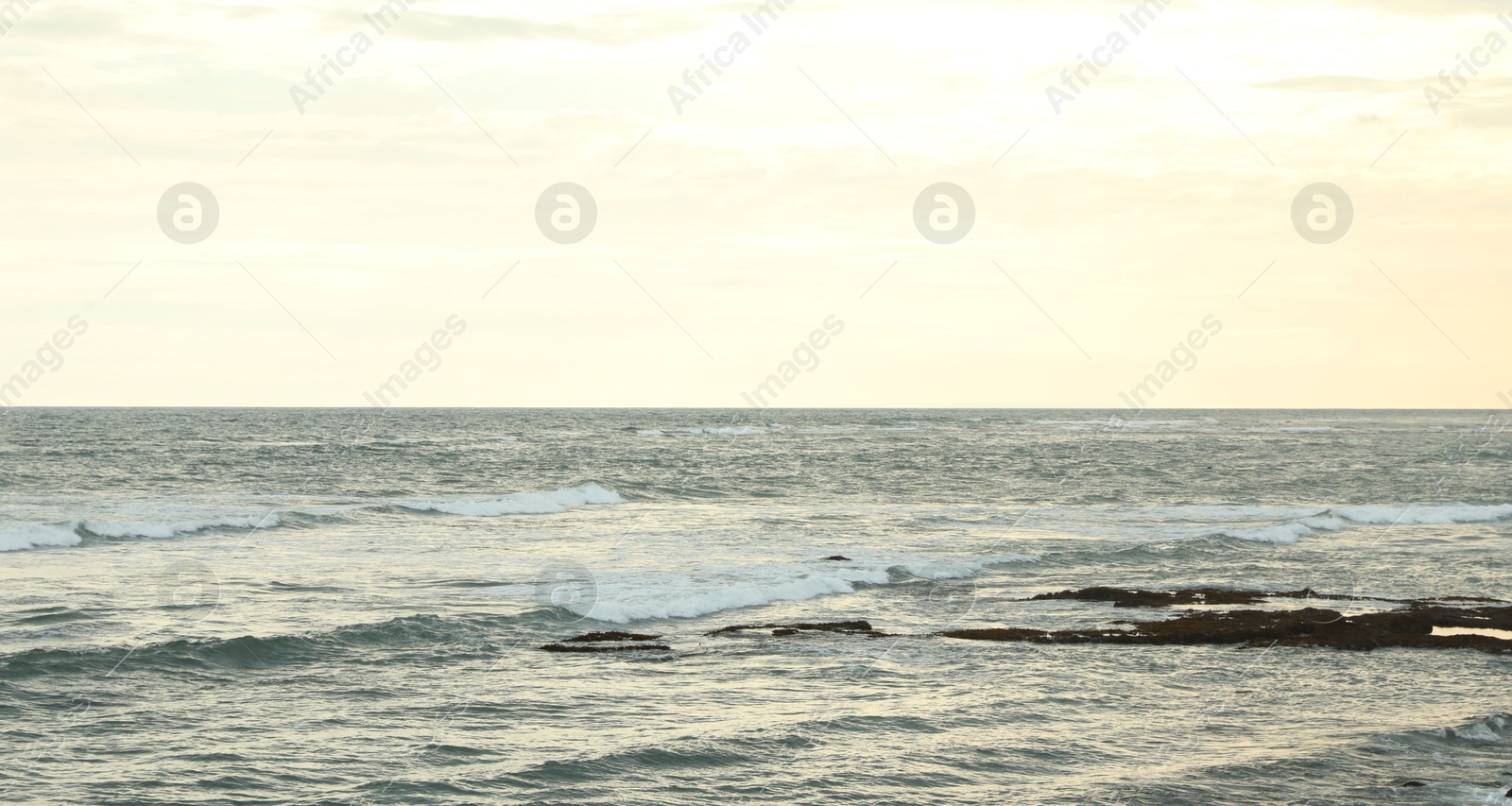 View of wavy sea under beautiful sky Photo of View of wavy sea under beautiful sky