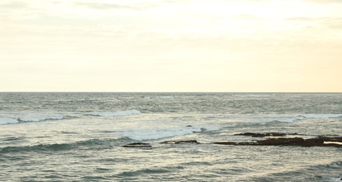Photo of View of wavy sea under beautiful sky
