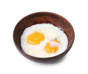 Photo of Half-boiled eggs in bowl isolated on white