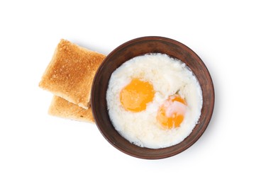 Photo of Half-boiled eggs in bowl and toasted bread isolated on white, top view