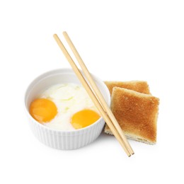 Photo of Half-boiled egg in bowl, chopsticks and toasted bread isolated on white