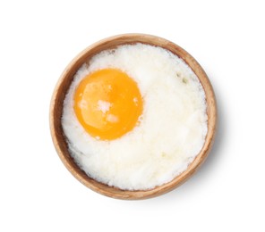 Photo of Half-boiled egg in bowl isolated on white, top view