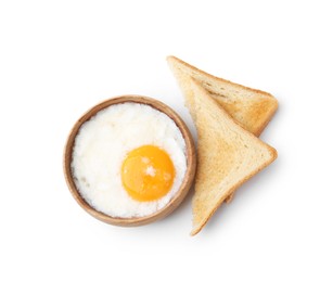 Photo of Half-boiled egg in bowl and toasted bread isolated on white, top view