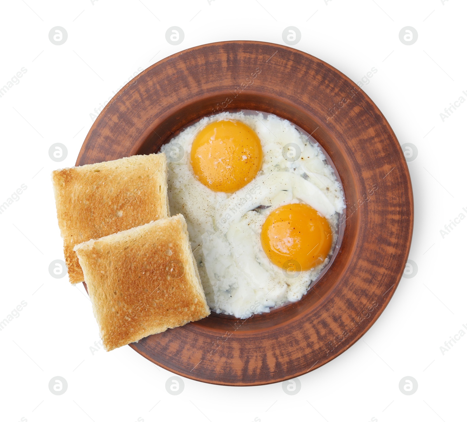 Half-boiled eggs in plate and toasted bread isolated on white, top view Photo of Half-boiled eggs in plate and toasted bread isolated on white, top view
