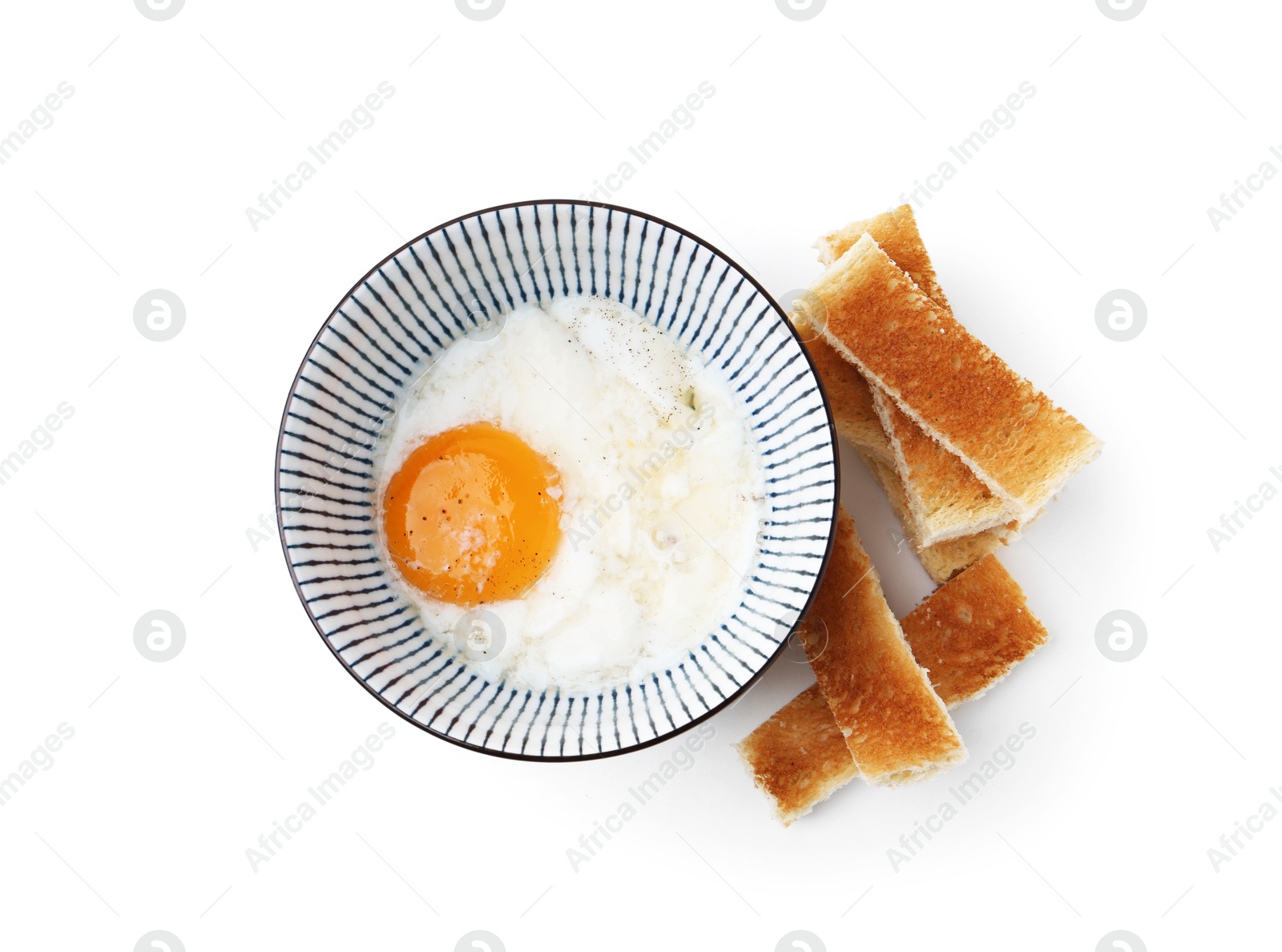 Half-boiled egg in bowl and toasted bread isolated on white, top view Photo of Half-boiled egg in bowl and toasted bread isolated on white, top view