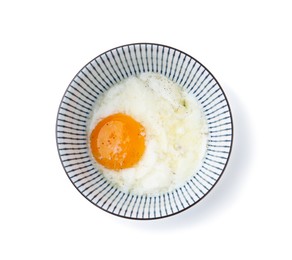Photo of Half-boiled egg in bowl isolated on white, top view