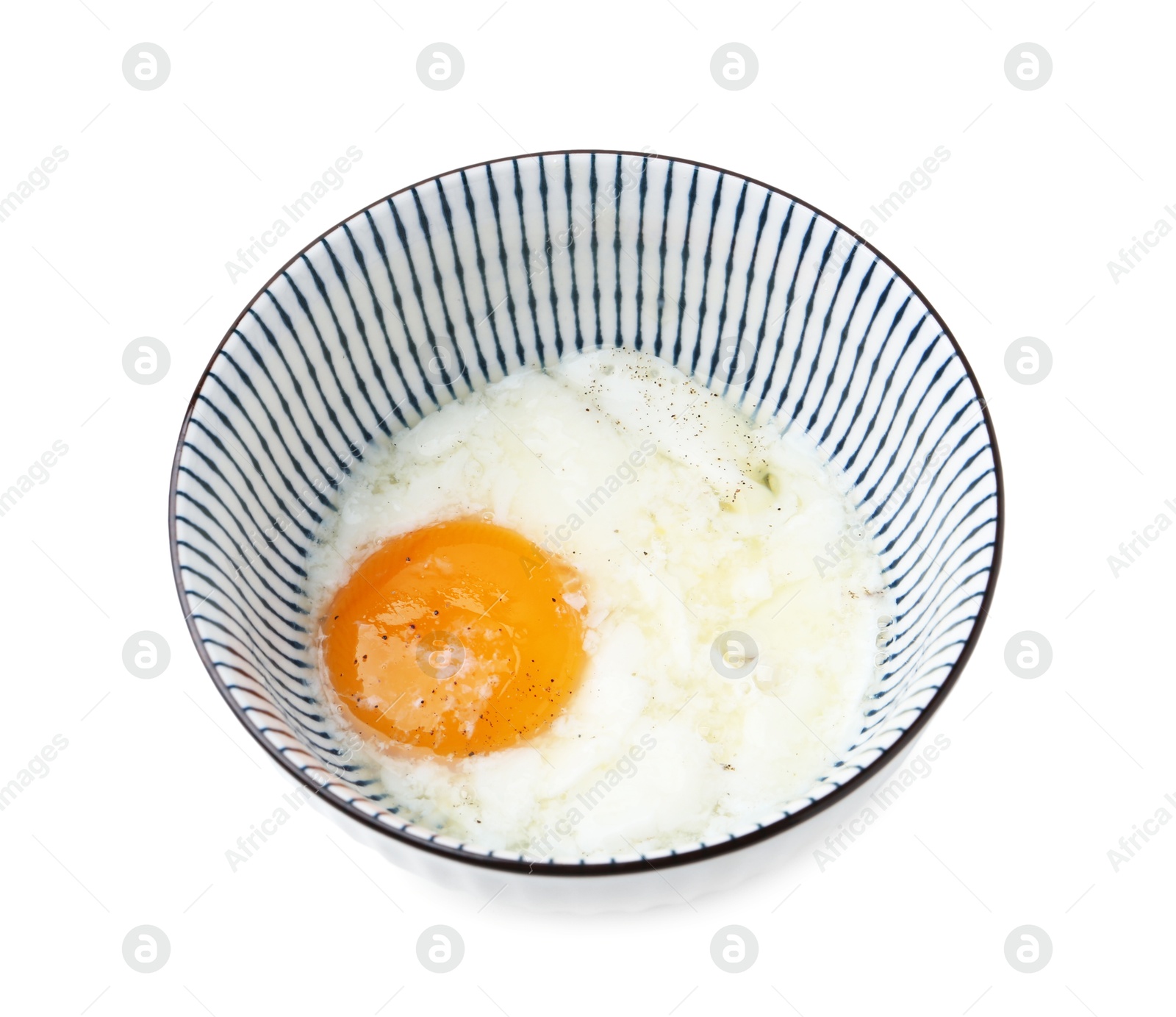 Half-boiled egg in bowl isolated on white Photo of Half-boiled egg in bowl isolated on white