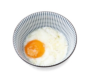 Photo of Half-boiled egg in bowl isolated on white