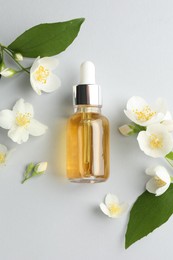 Photo of Cosmetic product and jasmine flowers on light background, flat lay