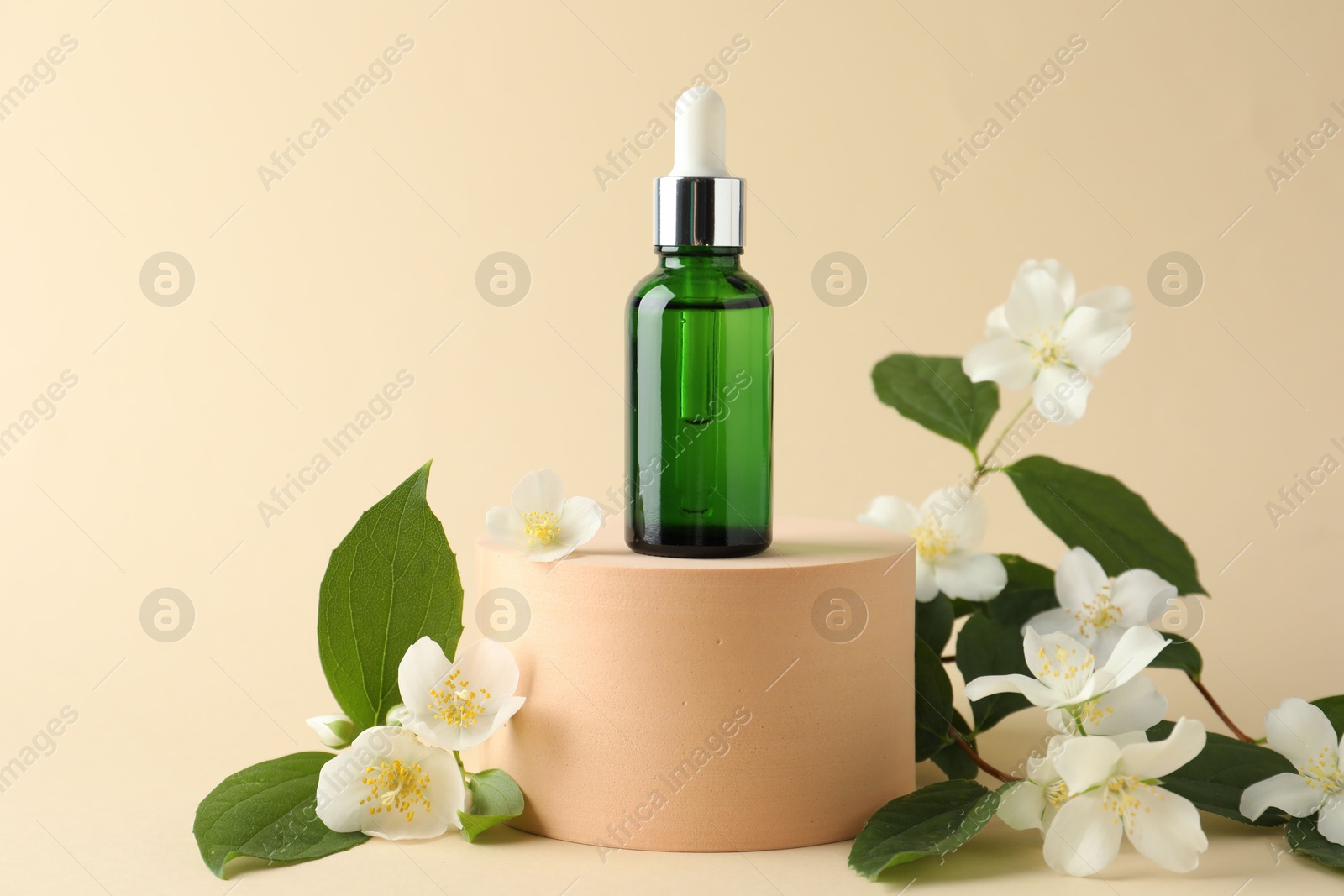 Cosmetic product and jasmine flowers on beige background Photo of Cosmetic product and jasmine flowers on beige background