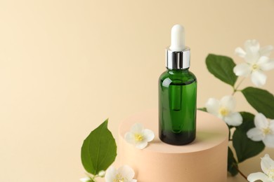 Photo of Cosmetic product and jasmine flowers on beige background, closeup. Space for text