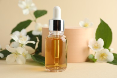 Photo of Cosmetic product and jasmine flowers on beige background, closeup
