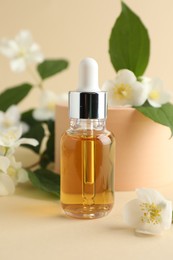 Photo of Cosmetic product and jasmine flowers on beige background, closeup