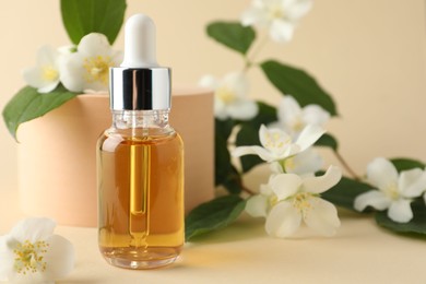 Photo of Cosmetic product and jasmine flowers on beige background, closeup