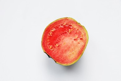 Photo of Half of juicy guava on white background, top view
