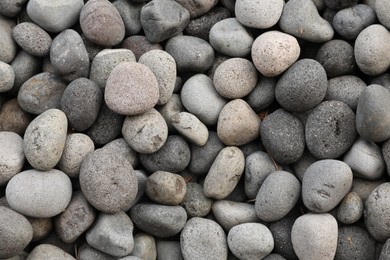 Photo of Many different pebbles as background, top view