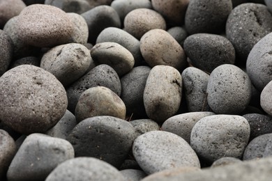 Photo of Many different pebbles as background, closeup view