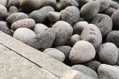 Photo of Many different pebbles as background, closeup view