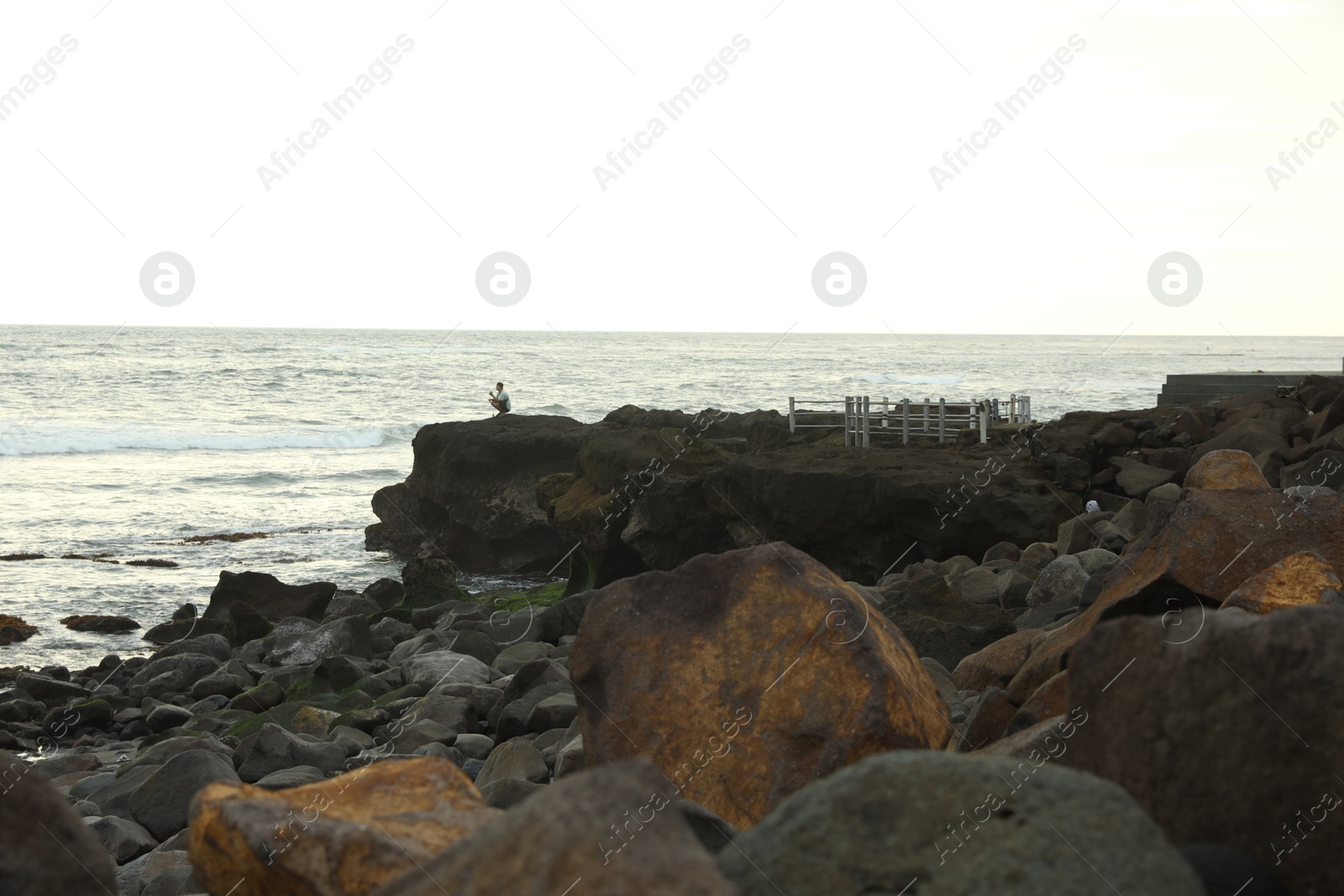 Bali, Indonesia - May 27, 2025: View of wavy sea and rocky beach Photo of Bali, Indonesia - May 27, 2025: View of wavy sea and rocky beach