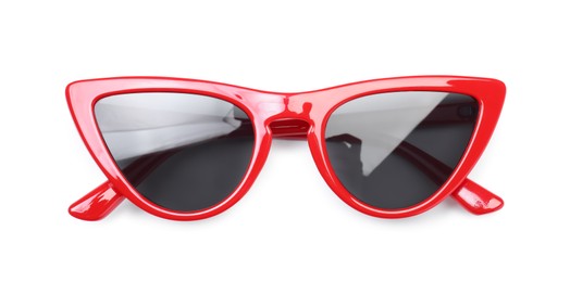 Photo of Stylish red sunglasses isolated on white, top view. Beach accessory