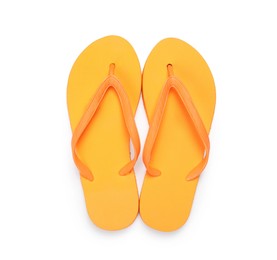 Photo of Stylish orange flip flops isolated on white, top view. Beach accessory