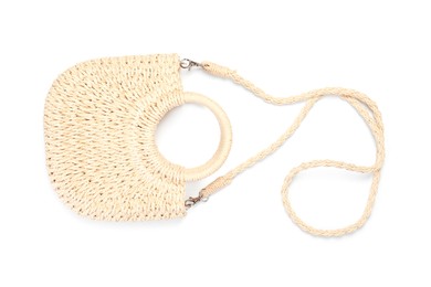 Photo of Stylish wicker bag isolated on white, top view. Beach accessory