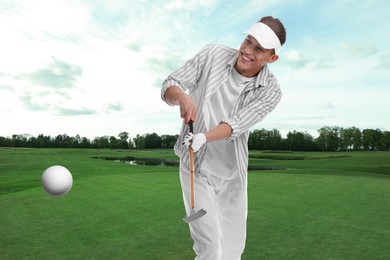 Image of Golfer hitting ball with club on course