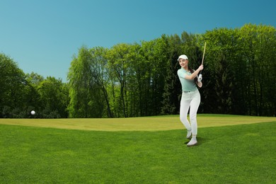 Image of Woman with club playing golf on green course