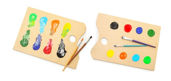 Image of Wooden palette with paints and brushes isolated on white, collage