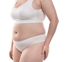 Photo of Weight loss. Plus size woman in underwear on white background, closeup