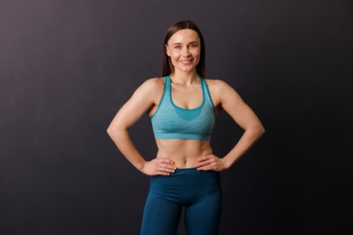 Photo of Portrait of professional trainer on black background