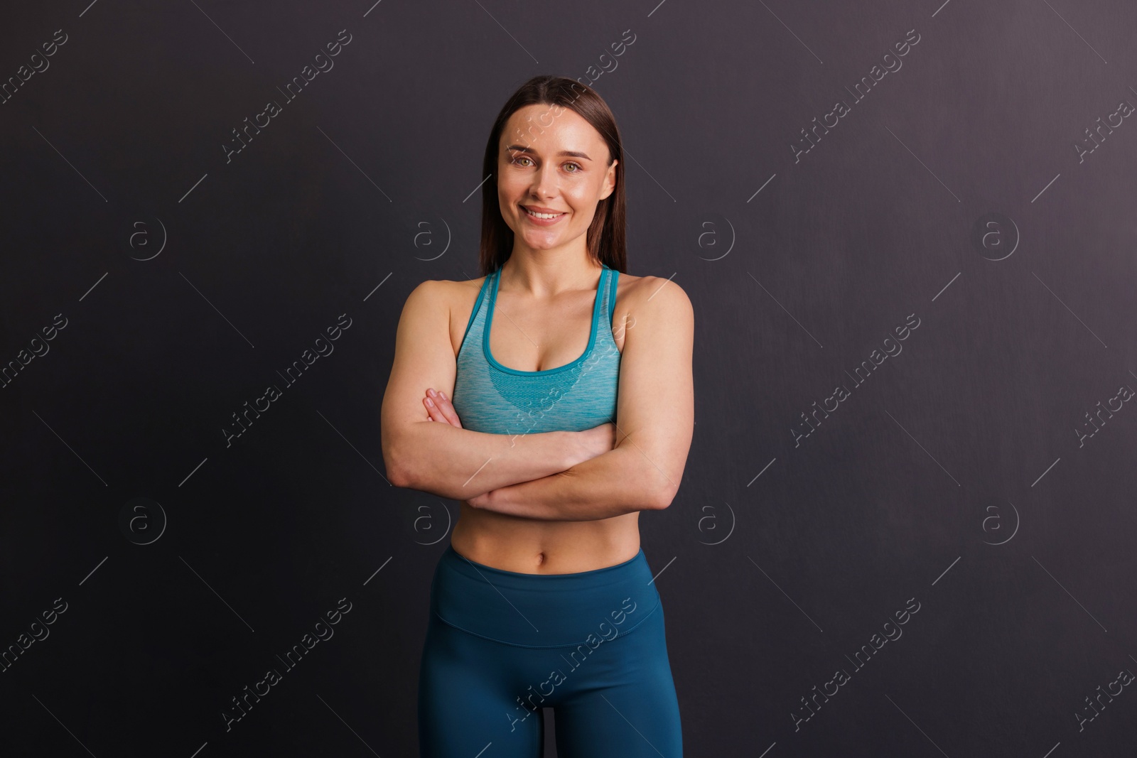 Portrait of professional trainer on black background Photo of Portrait of professional trainer on black background