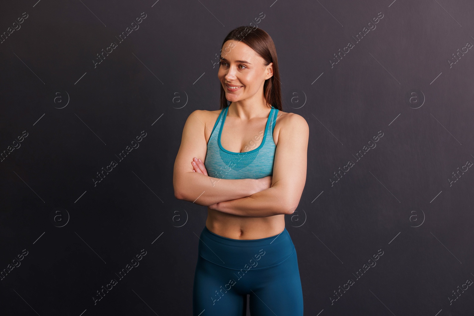 Portrait of professional trainer on black background Photo of Portrait of professional trainer on black background