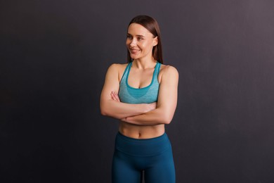Photo of Portrait of professional trainer on black background
