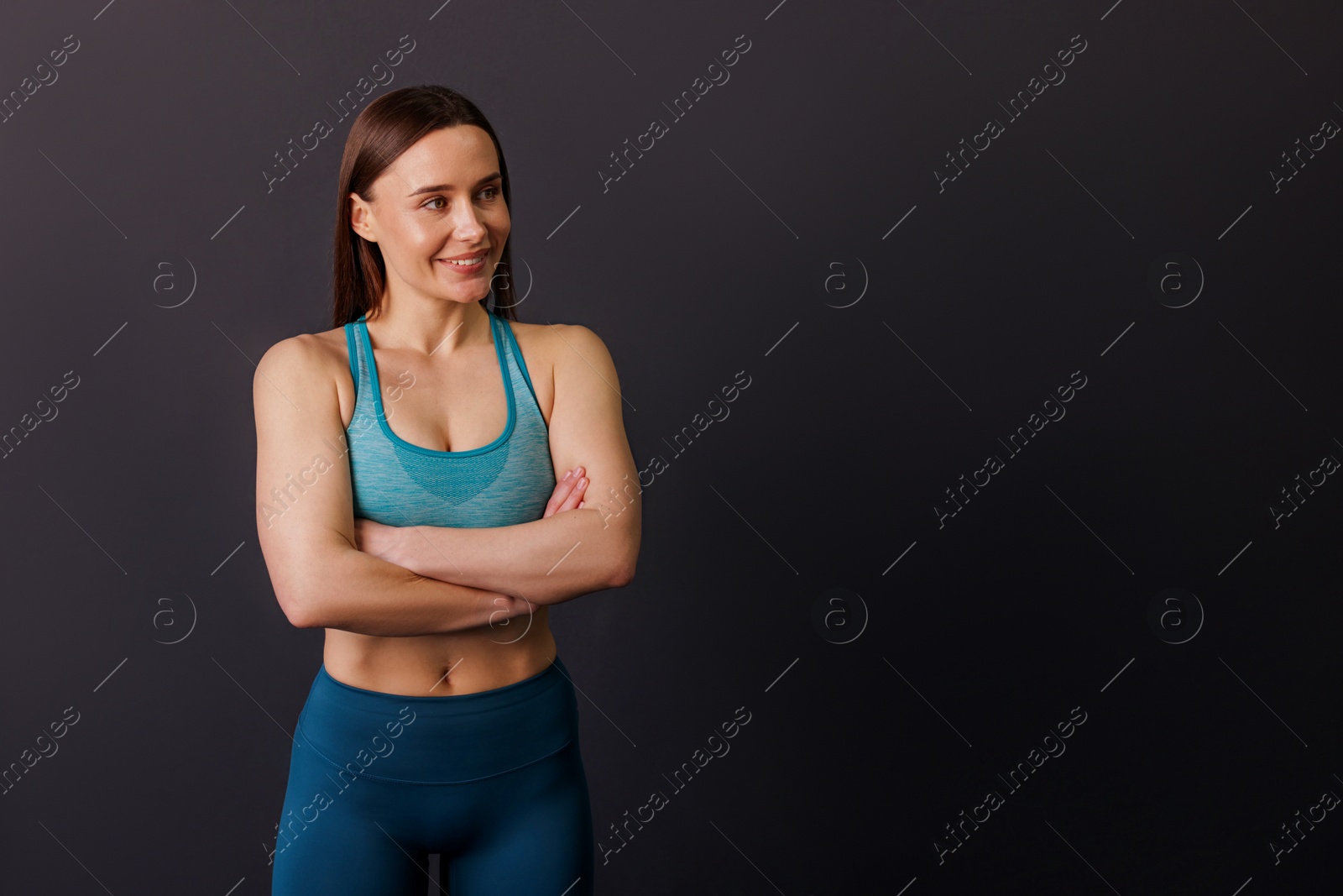 Portrait of professional trainer on black background. Space for text Photo of Portrait of professional trainer on black background. Space for text